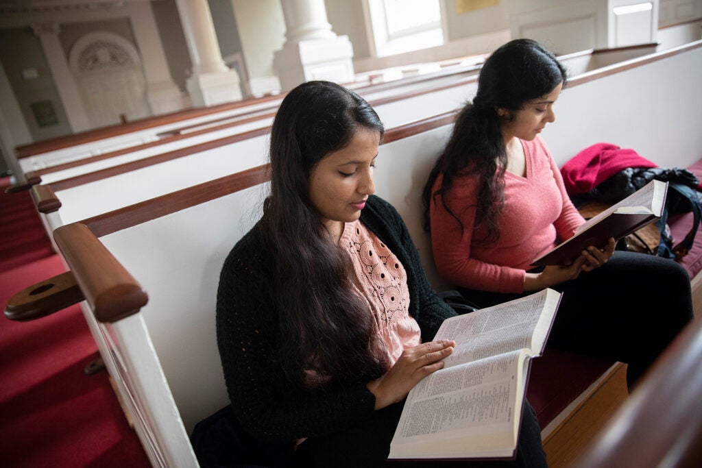 Lalitha Sindhuri (left) and Anandana Kapur read the Bible.