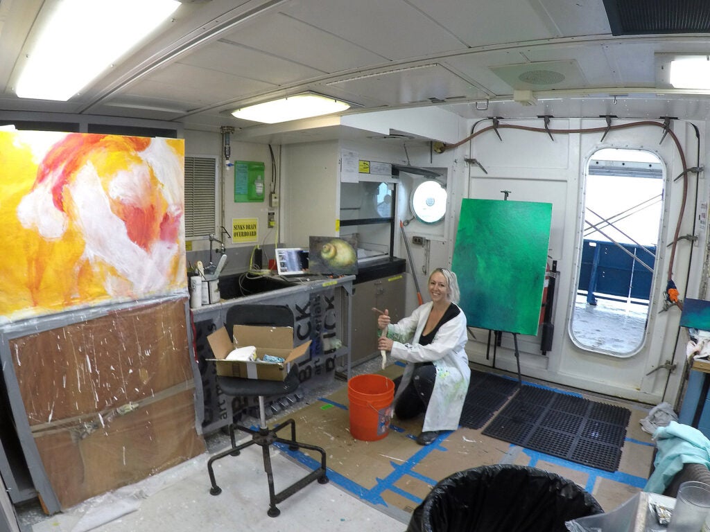 Artist Lily Simonson studies tubeworms while aboard a research vessel.