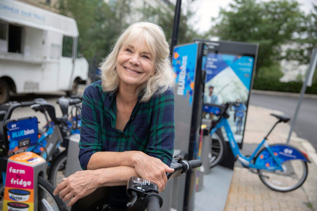 Leaning on a Blue Bike dock in front of Harvard Chan School, HSPH researcher Anne Lusk talks about how the explosion of bike-sharing is impacting overall health.