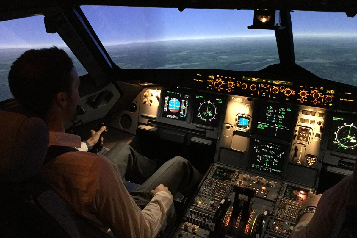 Pilot in cockpit.