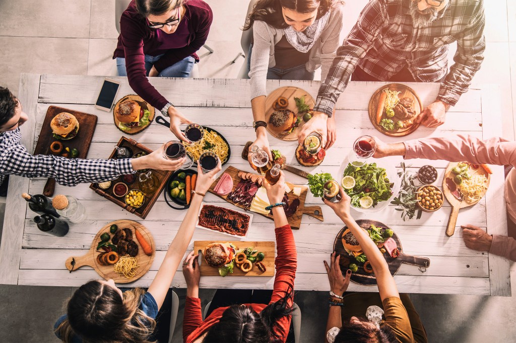 Group of people having meal togetherness