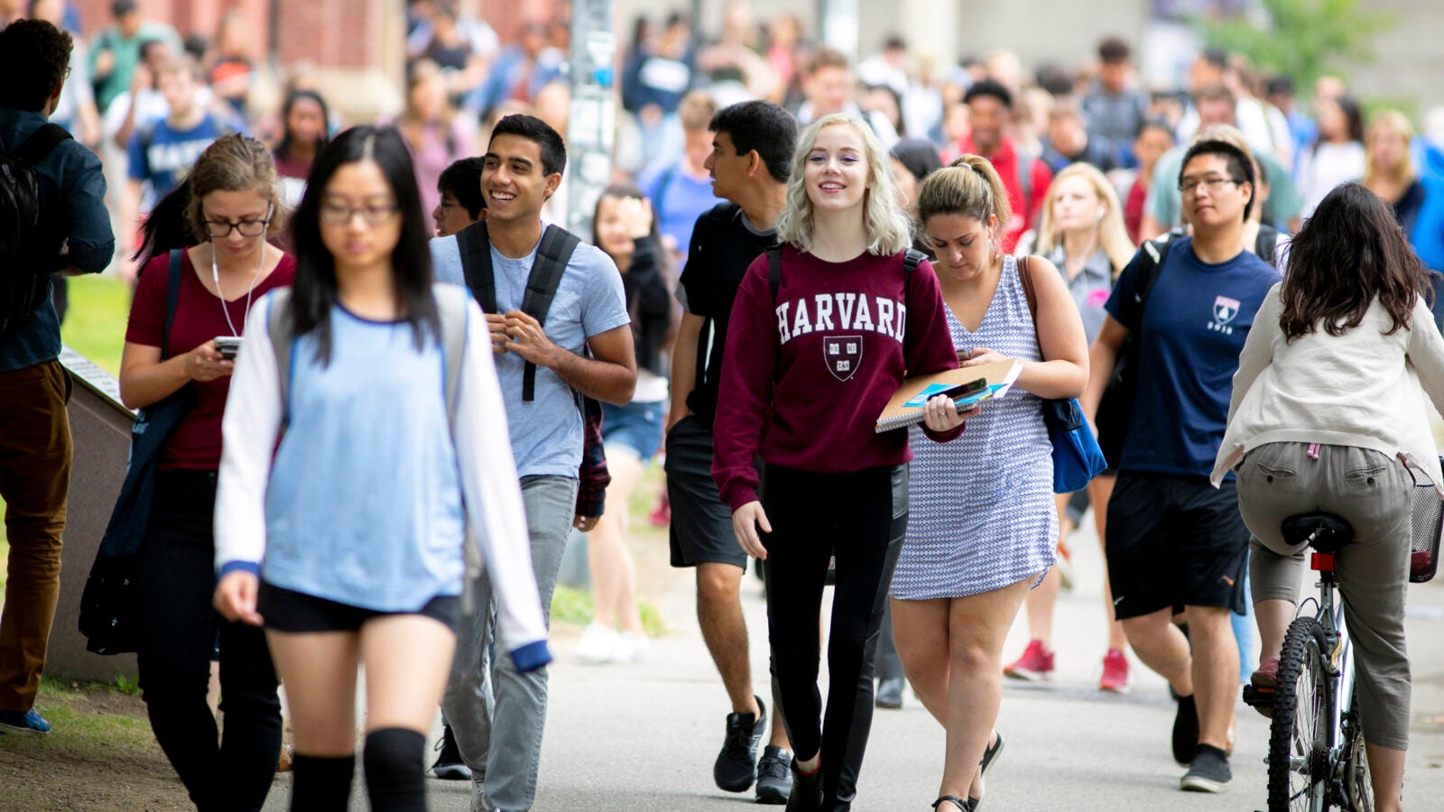 Students pass Memorial Hall on the first week of classes at Harvard College.