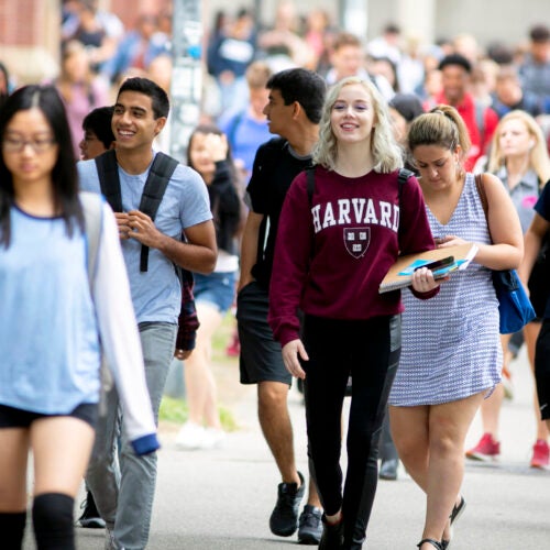 Students pass Memorial Hall on the first week of classes at Harvard College.