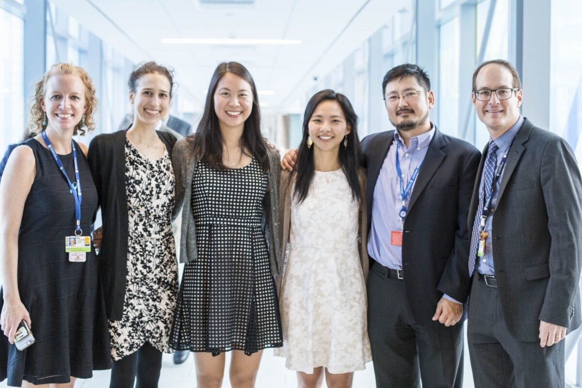 RESILIENT Co-directors Joyce Zhou and Mimi Yen Li (center) with BWH physicians Christin Price (from left), Galina Gheihman, Joji Suzuki, and Scott Weiner at the exhibit opening. Photo by Jordan Said