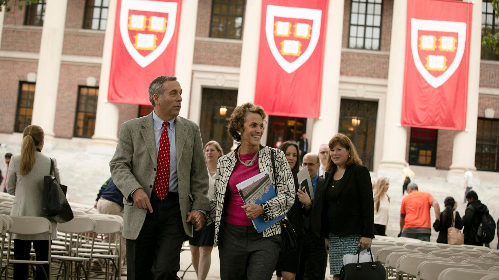 Harvard President Larry Bacow (left) and Adele Bacow walk through the schedule for his Inauguration two days before the event takes place.