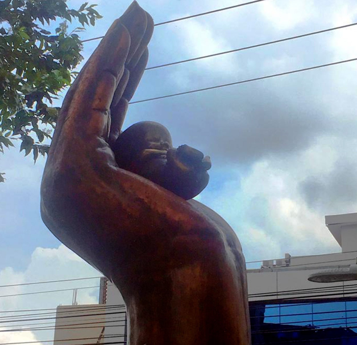A statue of a hand cradling a fetus