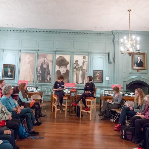 Speakers Anne Pender and Geraldine Brooks are sit flanked by audience at Houghton Library.