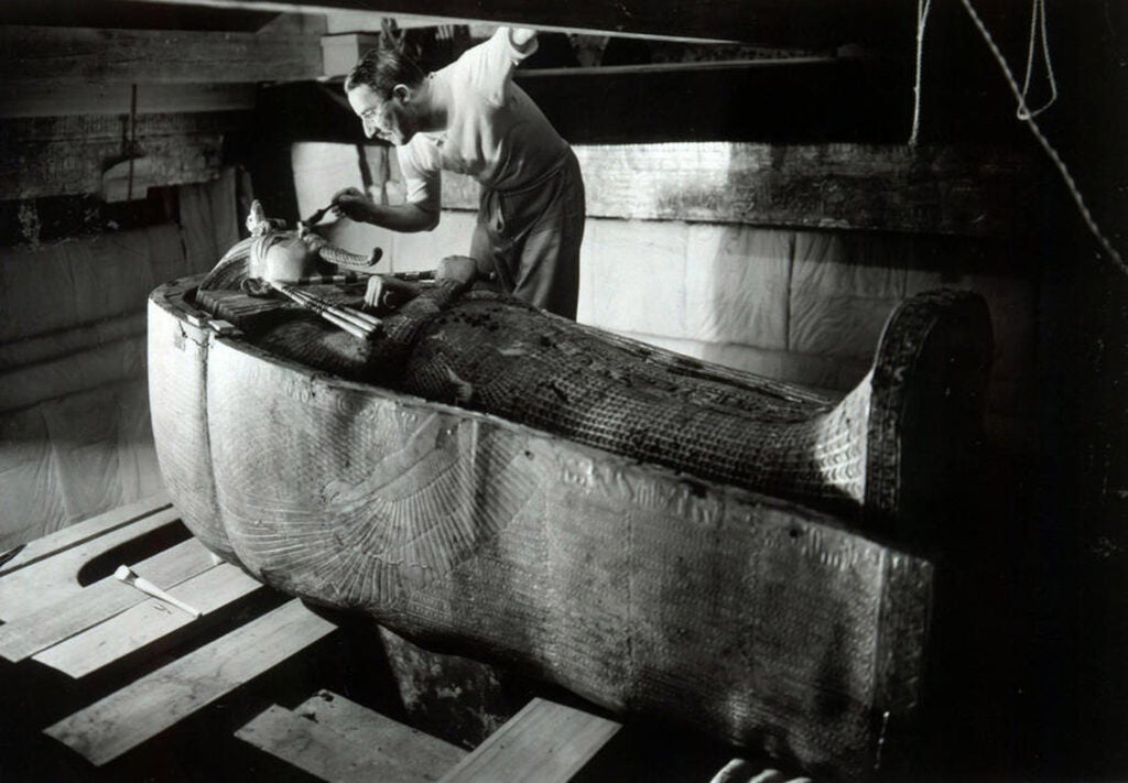 Howard Carter examines King Tut’s coffin in January, 1924.