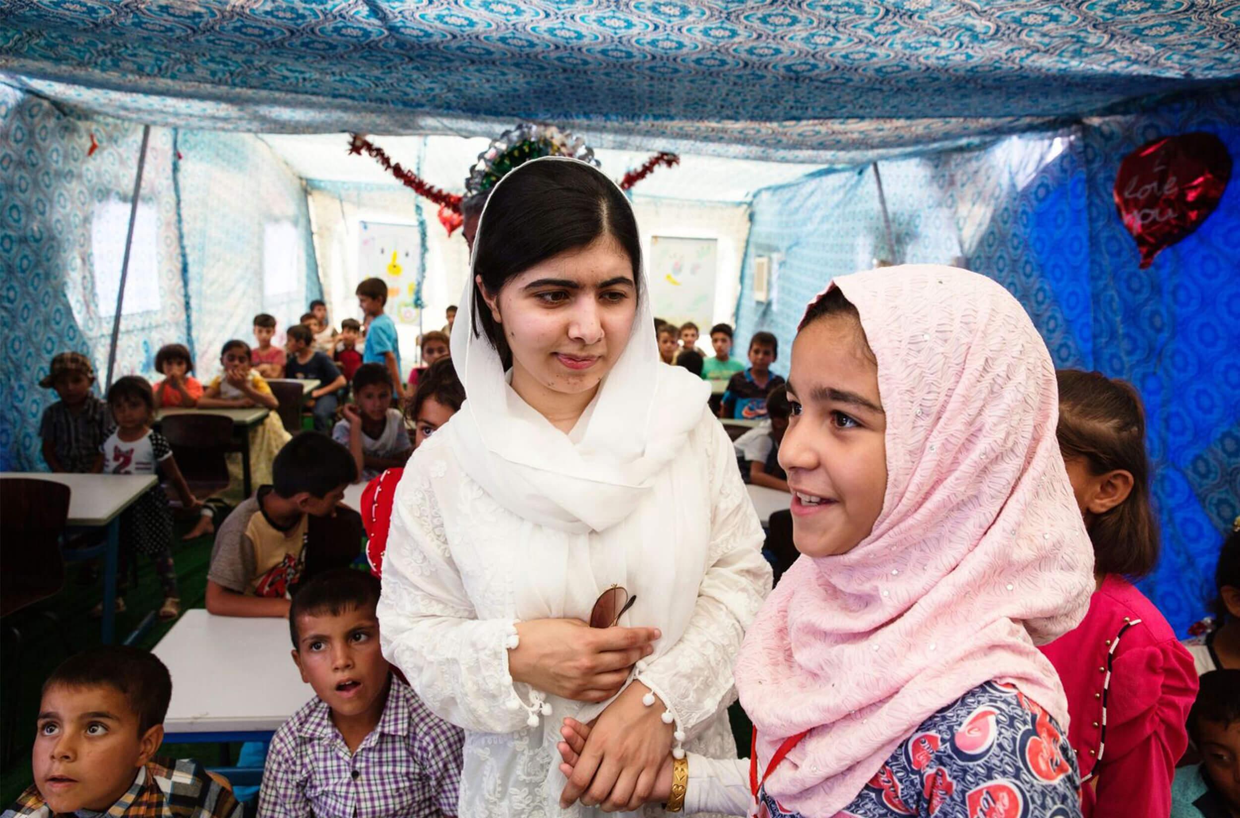 Malala Yousafzai in a classroom full of kids