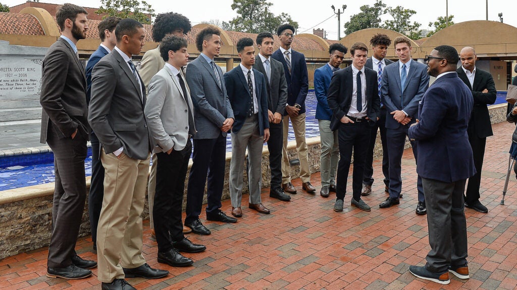 Harvard's men's basketball team visits The King Center in Atlanta.