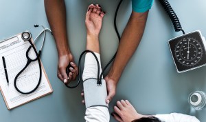 A person getting their blood pressure taken with a cuff