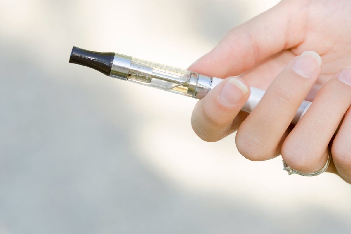 hand holding an electronic cigarette