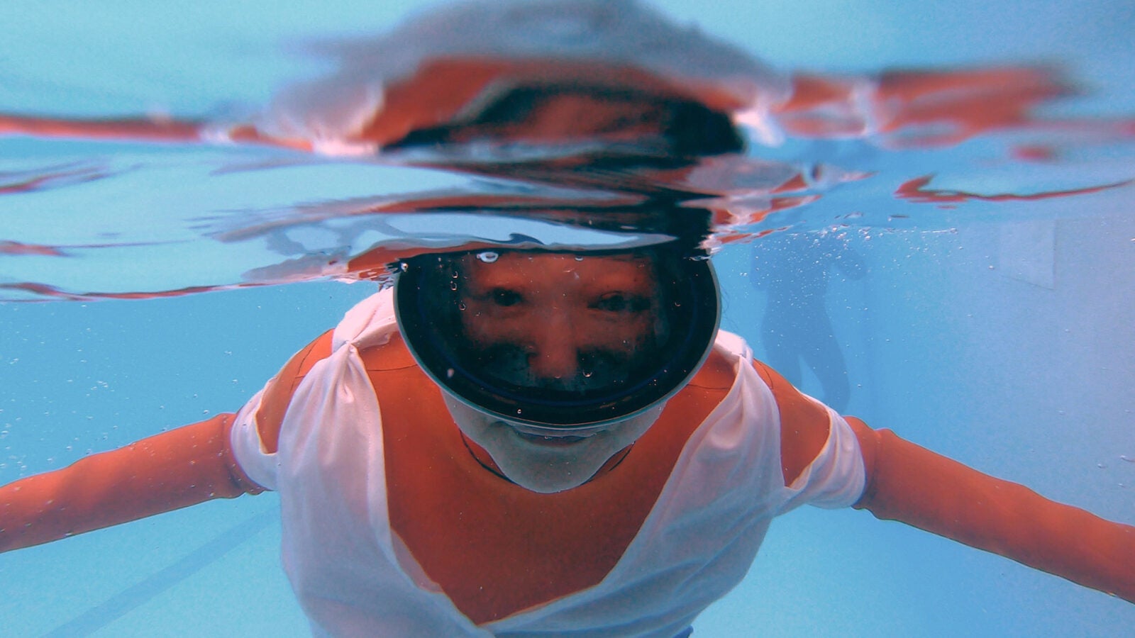 Jo Yang in rehearsal, diving underwater.