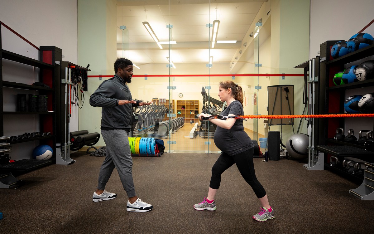 Talia Gillis works out at Hemenway gym with personal trainer Joel Waithe.