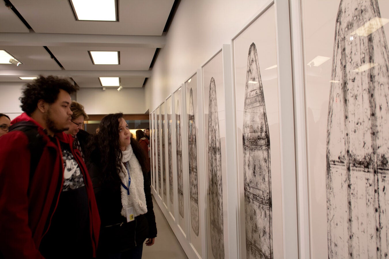Noel Pichardo and Jasmin De La Cruz view the exhibit.