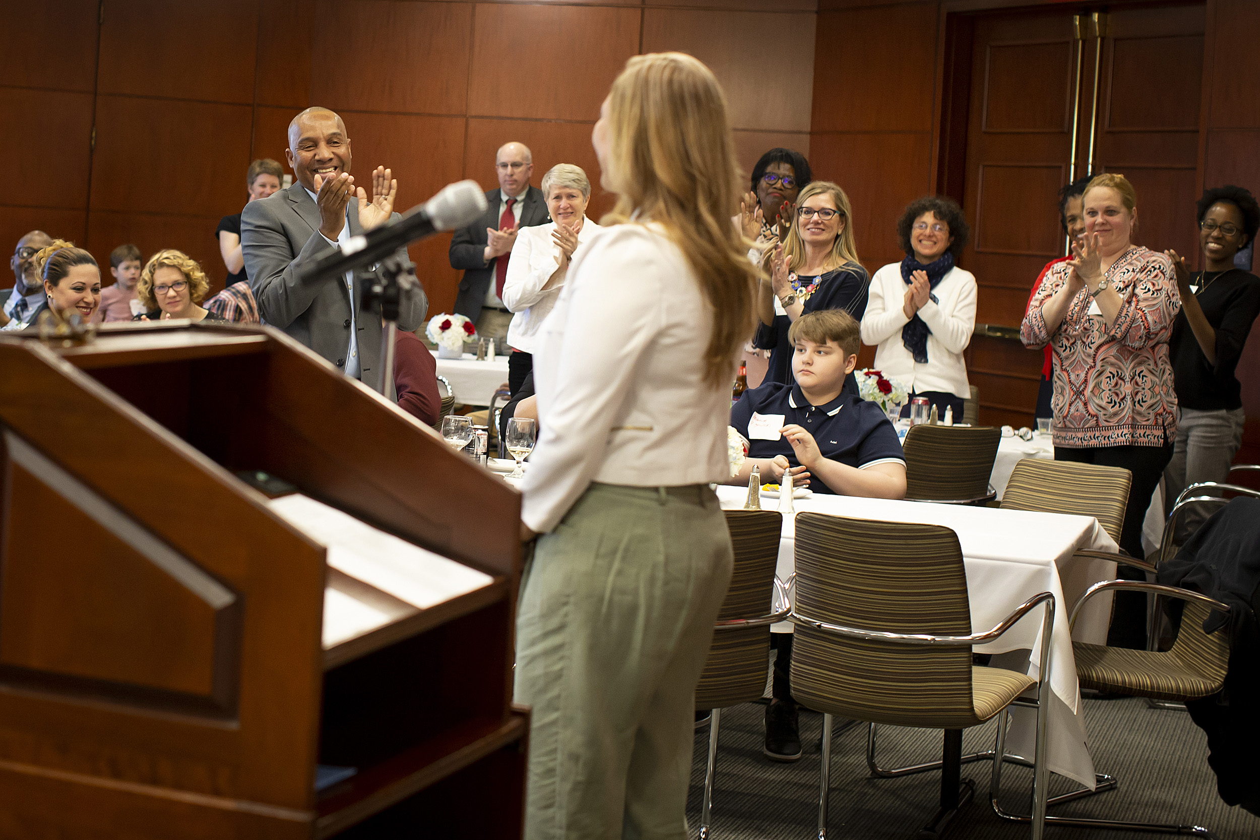 Luz Orozco receives a standing ovation after speaking at the Bridge Program annual dinner.