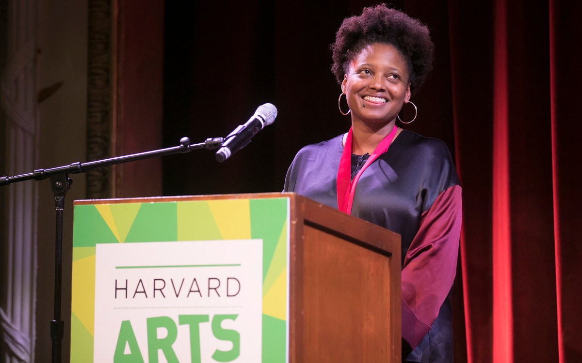 Tracy K. Smith smiles at the podium