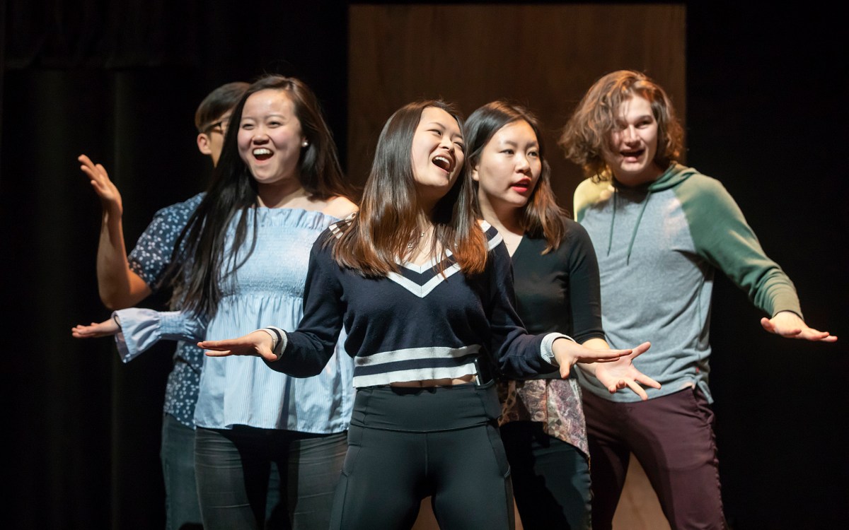 Performers dancing and singing