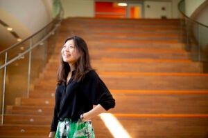 Cynthia Luo in front of stairs