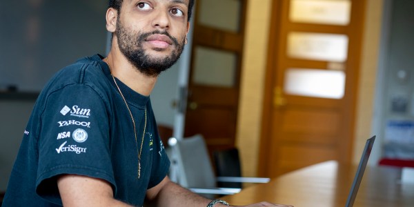 Jelani Nelson sitting in front of a laptop