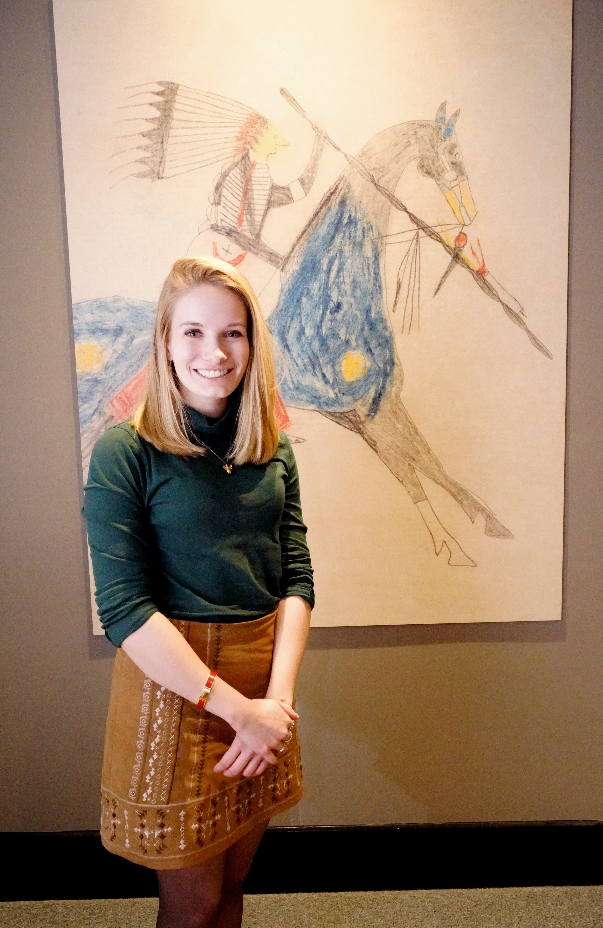 Ellis standing in front of a drawing