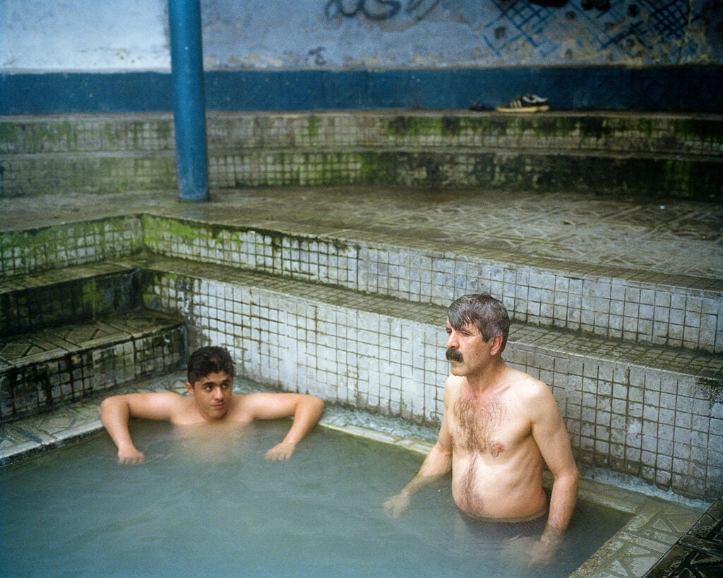 Father and son in Ishker hot springs.