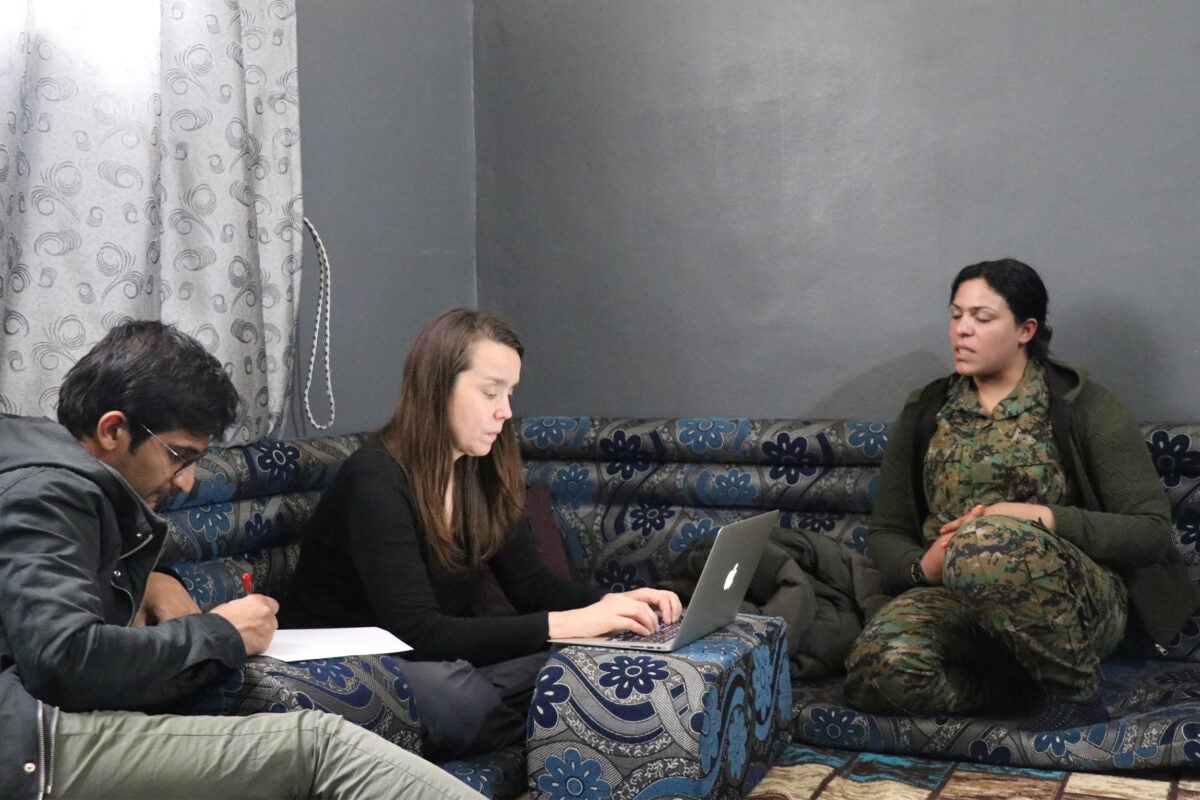 In northern Syria, Amy Austin Holmes conducts interviews