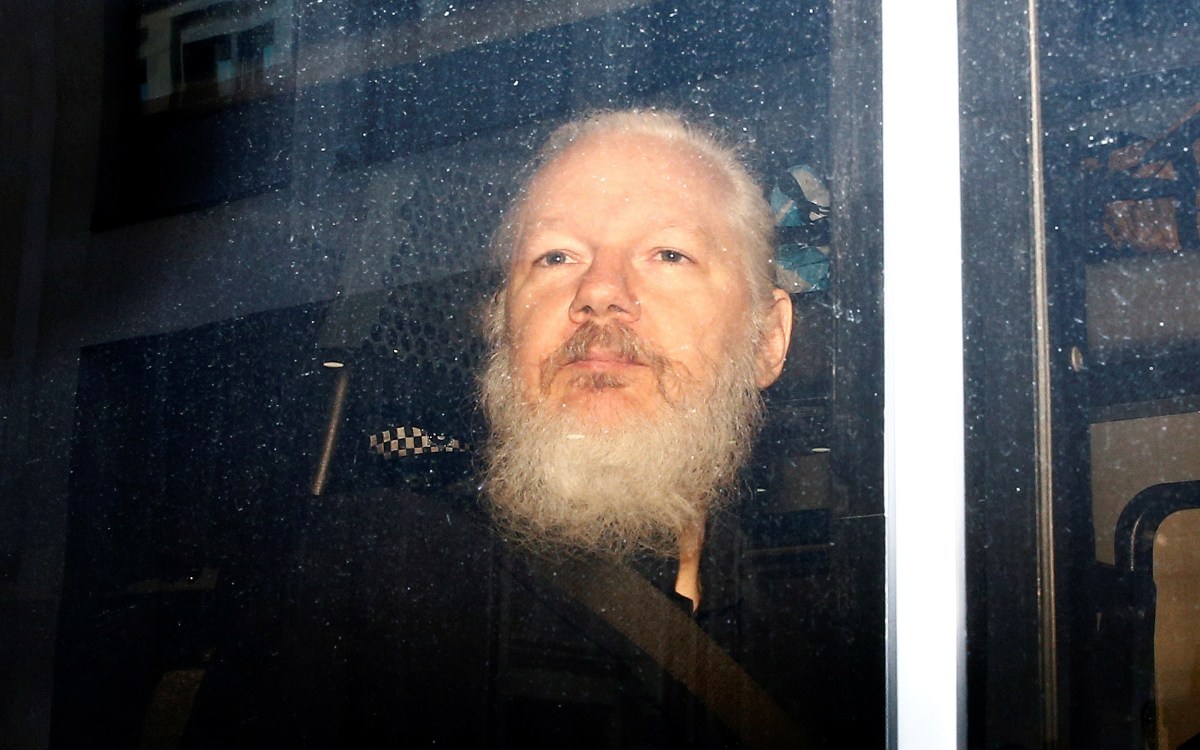 Julian Assange in a police van.