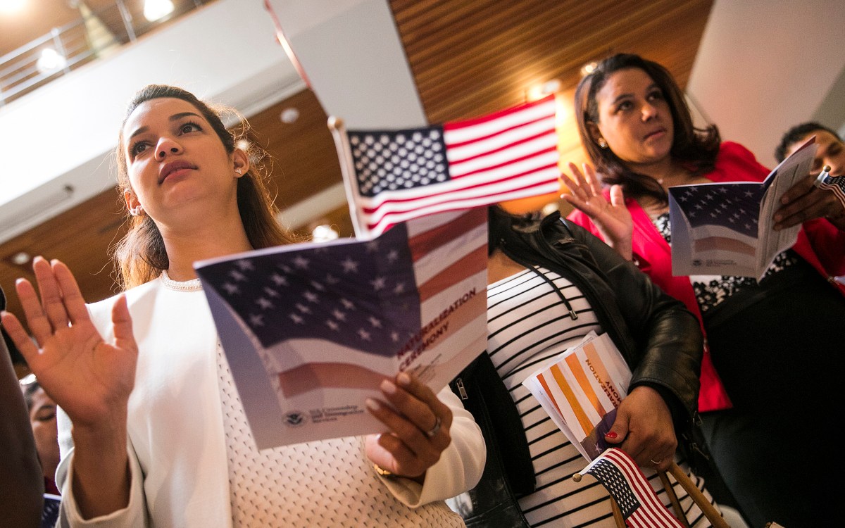 two women pledging during a citizenship ceremony
