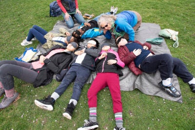 children lying on the grass
