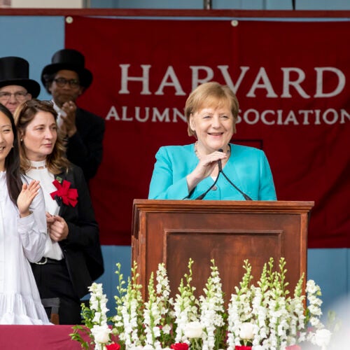 Angela Merkel speaks from podium.