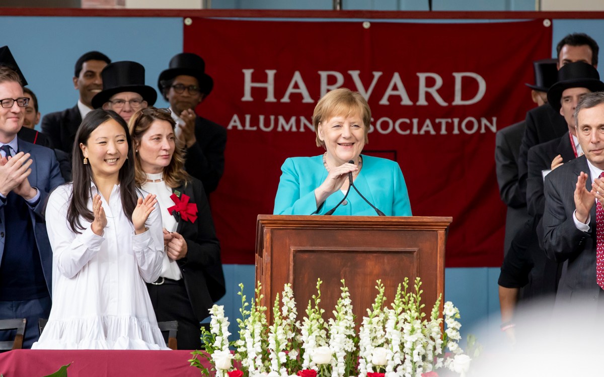 Angela Merkel speaks from podium.