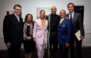 Six people including singer Alicia Keys and her husband Kasseem Dean pose for a group photo