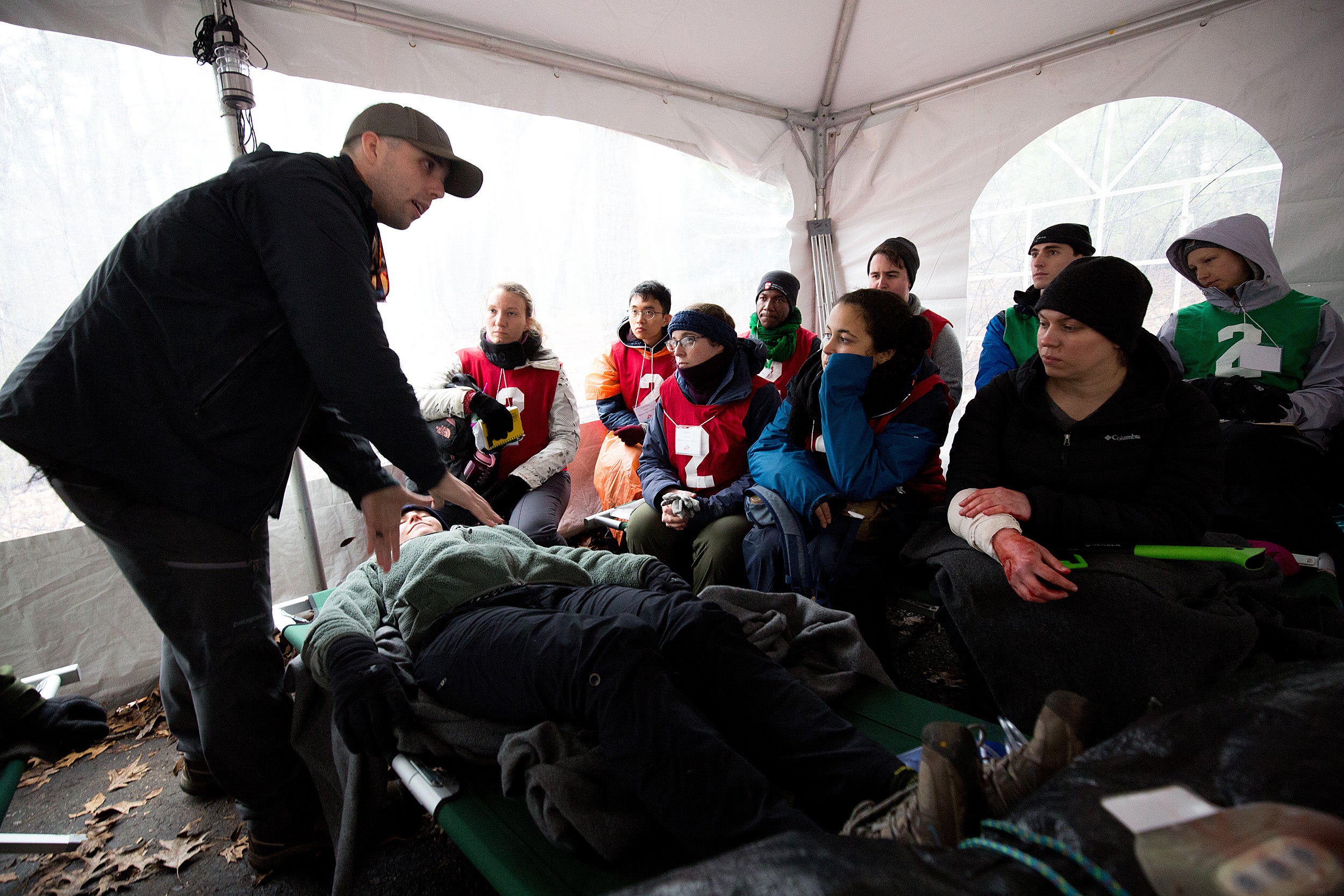 Participants learn to treat injuries in a humanitarian disaster simulation.