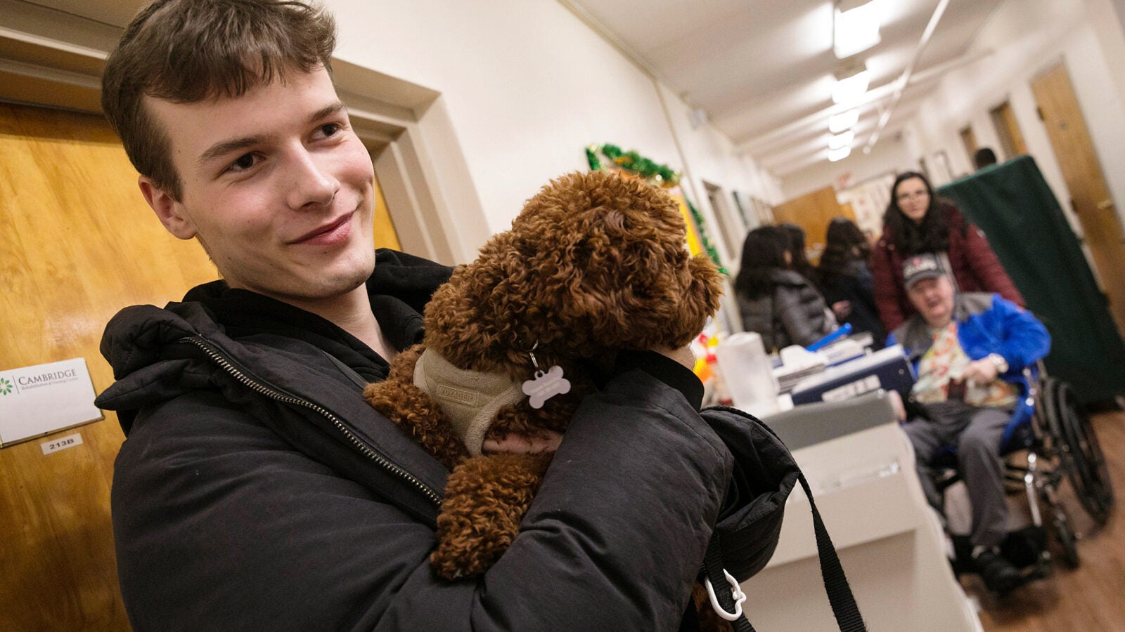 Man holding small dog