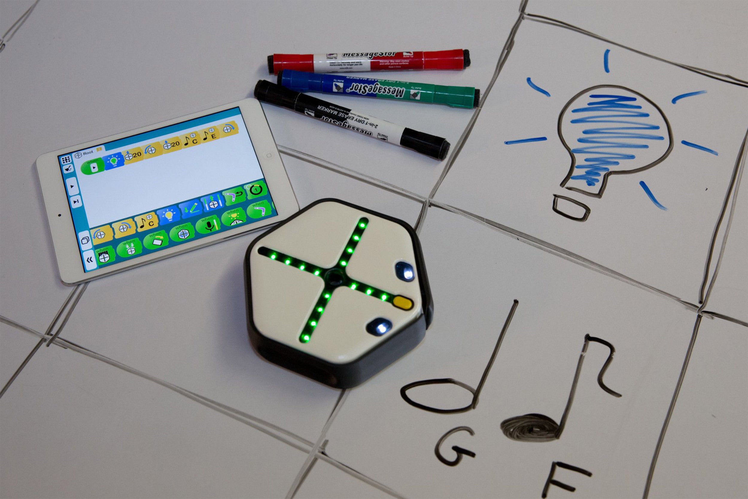 The Root robot with a whiteboard and iPad