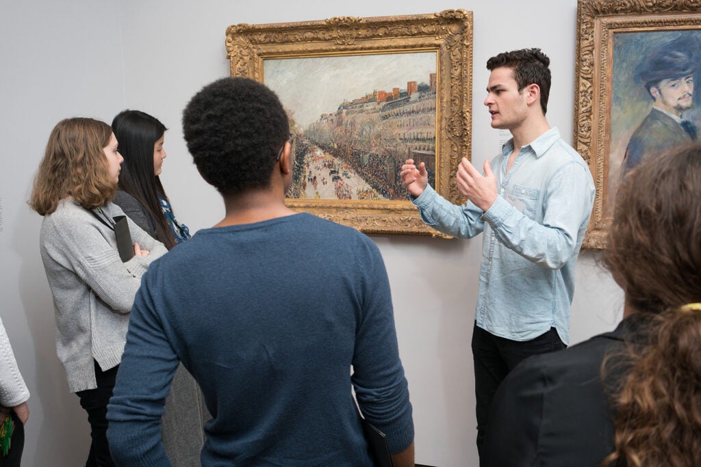 student guide discusses a painting