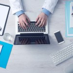 Aerial view of a doctor working on a laptop