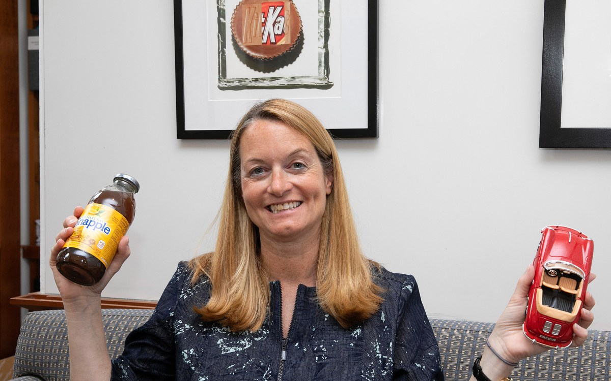 Jill Avery holds a toy car and a bottle of Snapple.