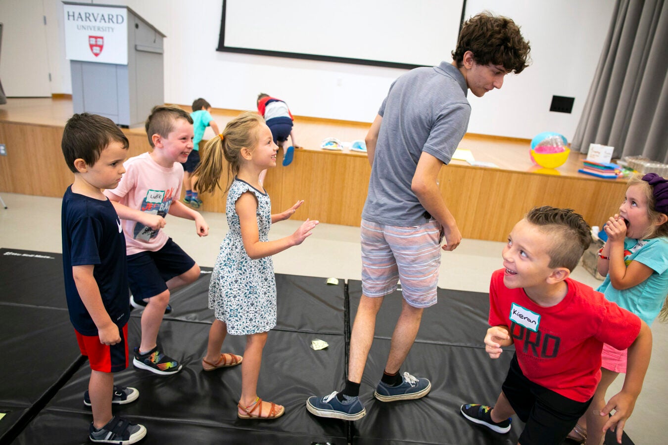 James DiSandro plays with children during acting class.