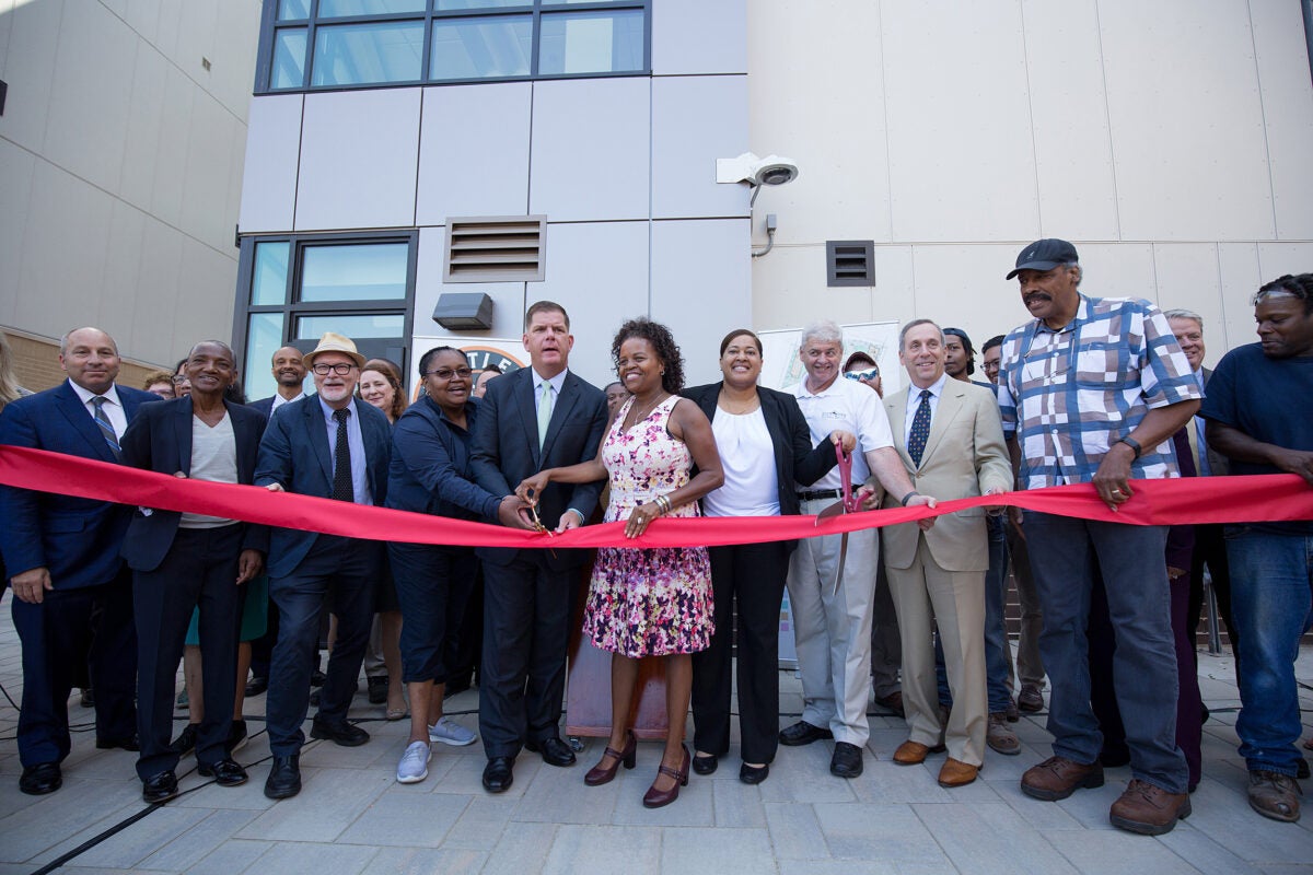 Community leaders including Harvard President Larry Bacow and Boston Mayor Martin J. Walsh celebrated the ribbon-cutting for the first phase of Bartlett Station in Roxbury Thursday