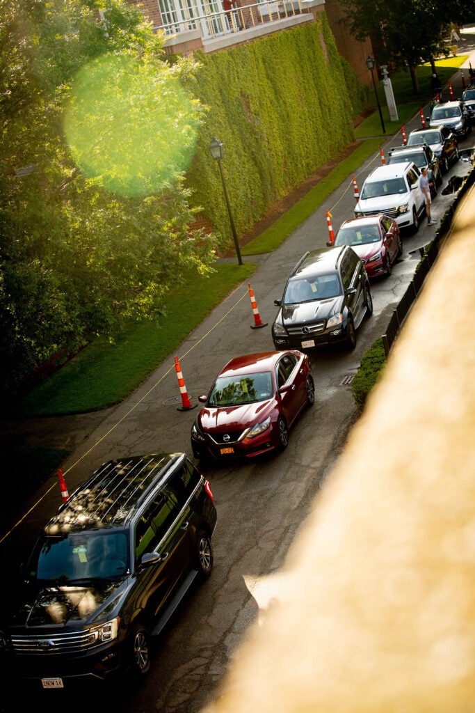 Cars are lined up at the Harvard stadium as first-year students move in to Harvard University