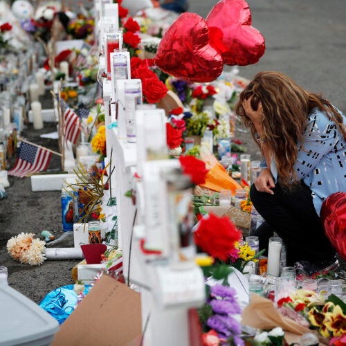 Woman mourns at memorial