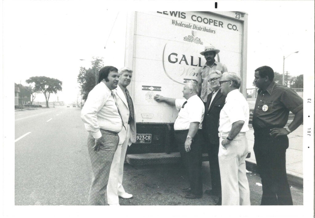 Men standing with a truck