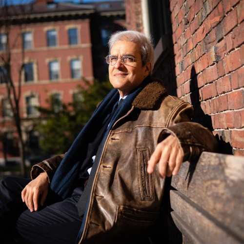 Moulay Hicham sitting on a bench.