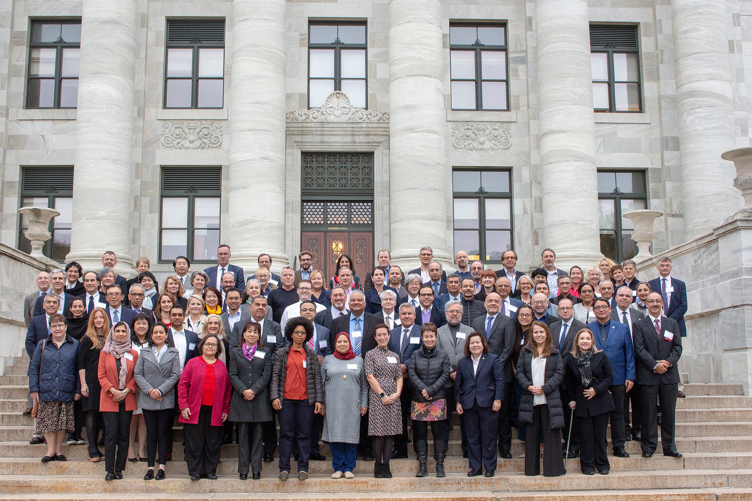 Group photo of symposium participants on the steps of Harvard Medical School