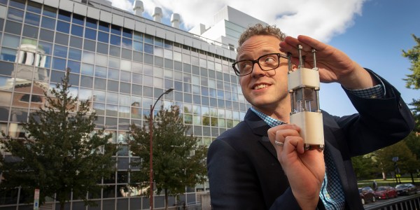 Christoffer Abrahamsson holding a small device