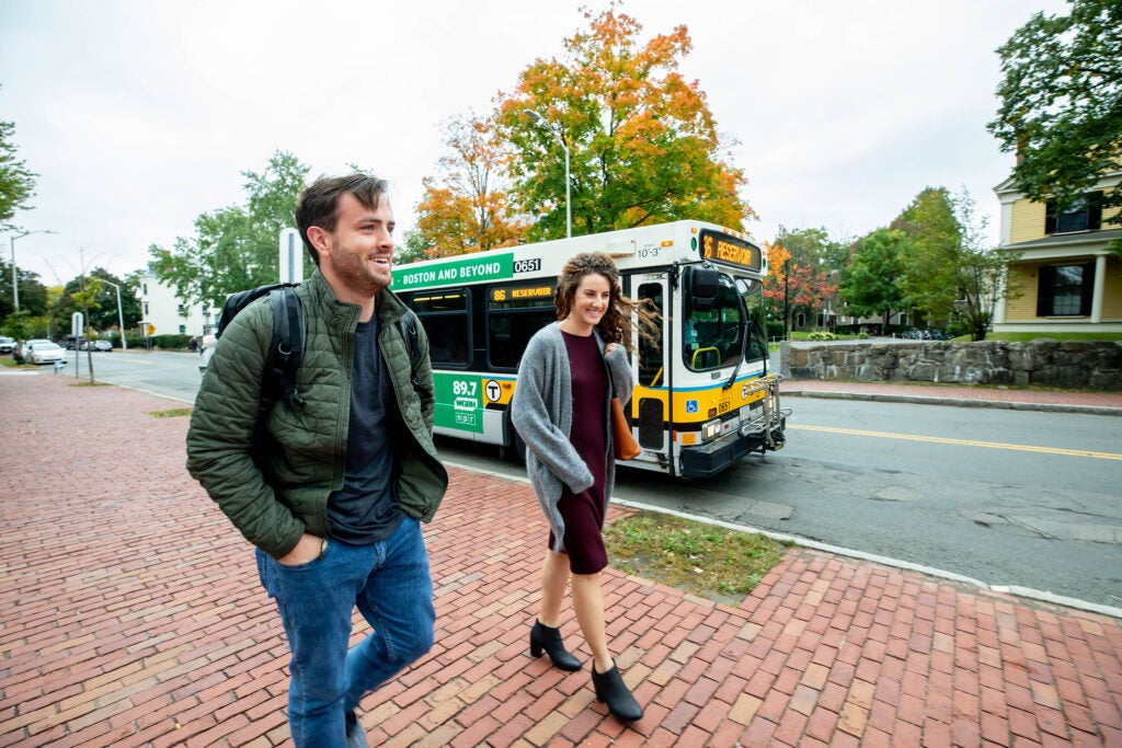 First-year student Hudson Miller and his wife, Hannah Miller, commute by bus to Harvard.