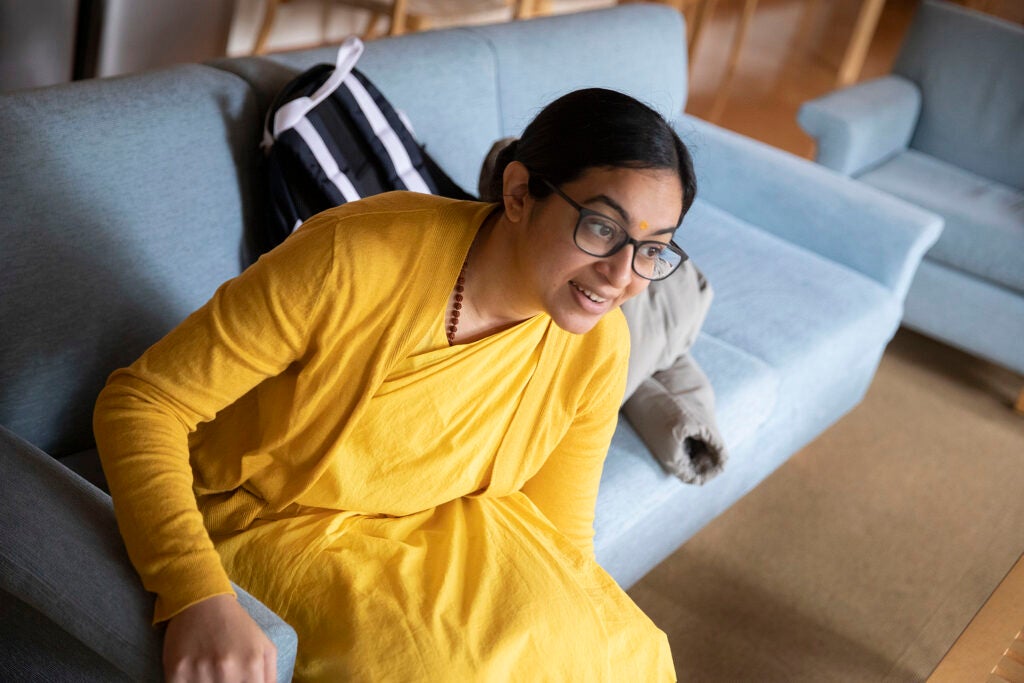 Brahmacharini Shweta Chaitanya sitting on a couch.