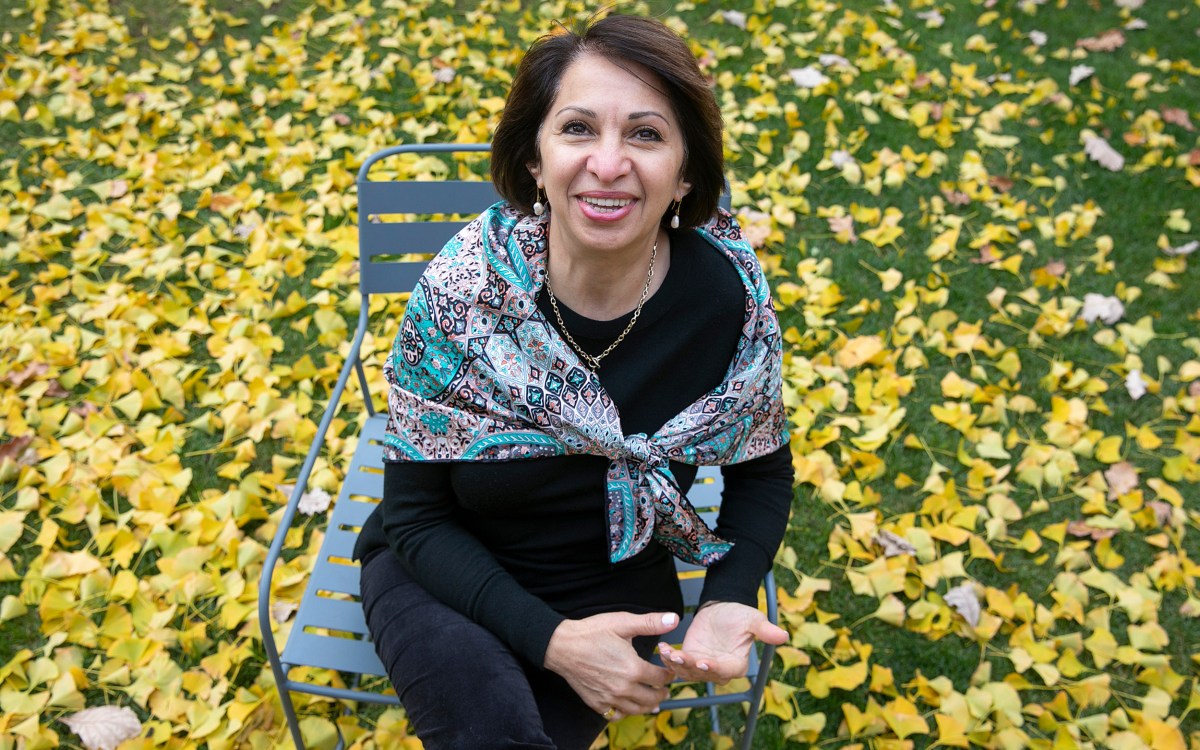 Woman sitting on bench.